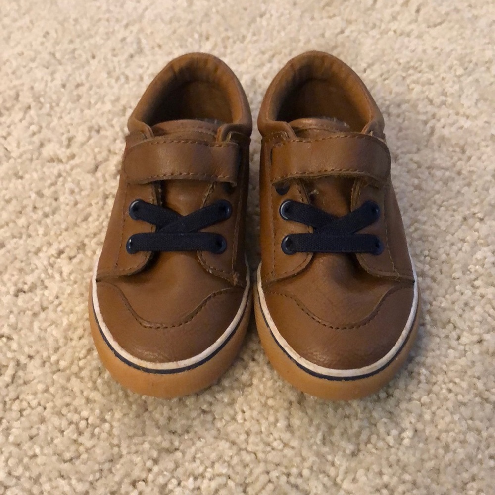 Brown leather with navy blue accent boys shoes.